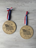 Wooden Ornament with waving American flag and fireworks celebrating America's 250th birthday