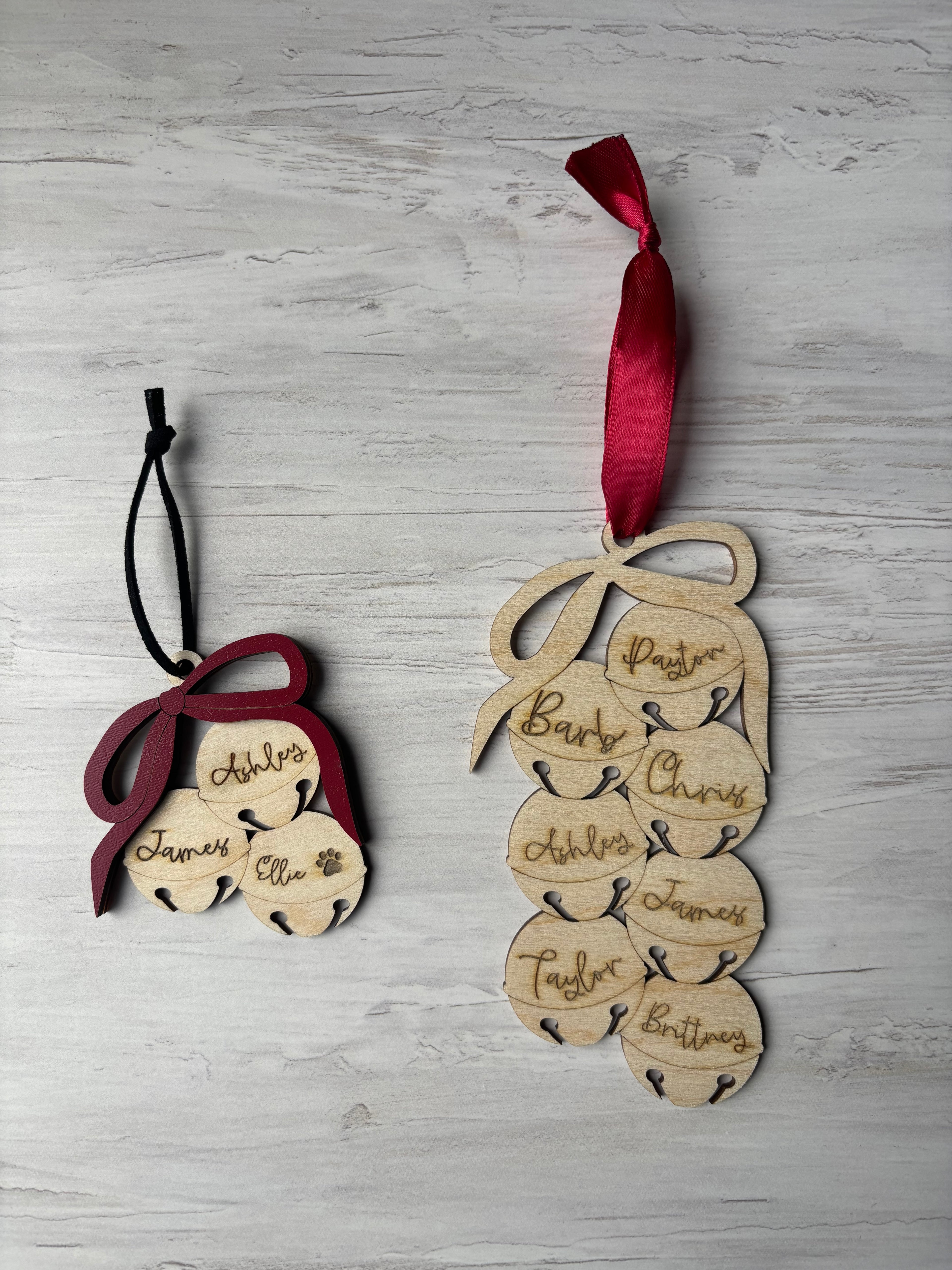 Christmas ornament shaped like bells with family names on each bell