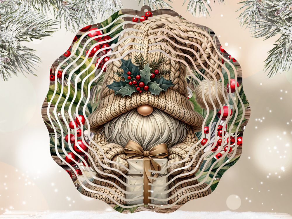 Decorative wind spinner with a gnome wearing a knitted hat and holding a gift, surrounded by holly leaves and berries by Coastal Ginger Creations