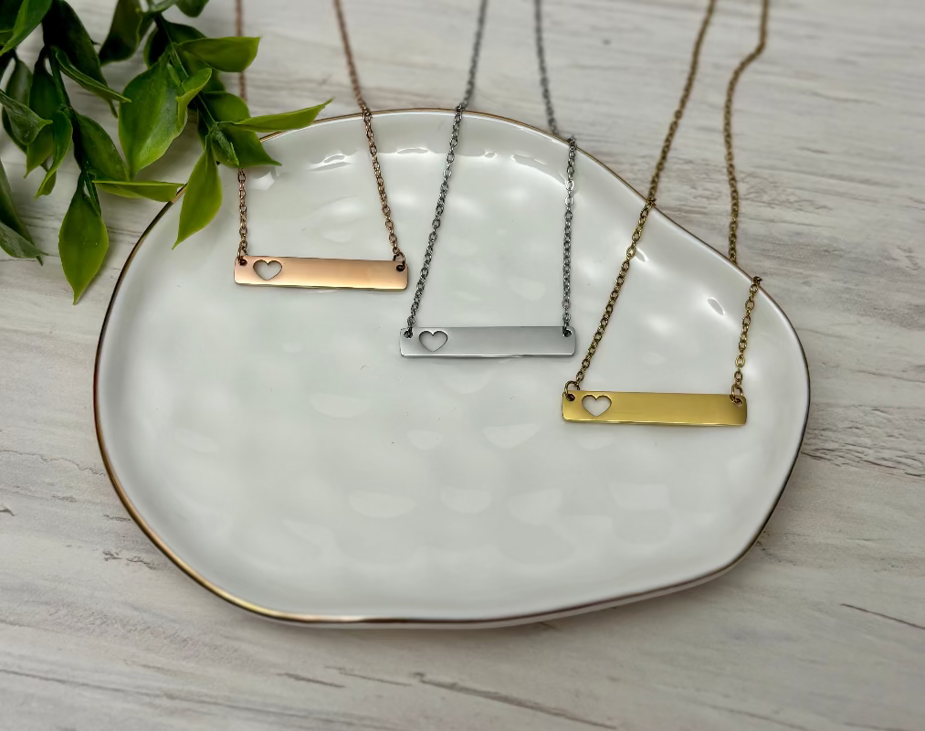 Rose Gold, Silver, or Gold bar necklace with a hear cut out perfect for engraving from Coastal Ginger Creations