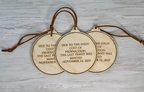 Back of historic penny ornament engraved with final penny minting date, wooden commemorative ornament honoring the end of the U.S. penny
