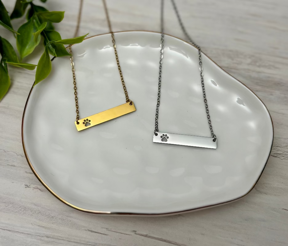 Bar Necklace with paw print cut out available in gold and silver perfect for personalization from Coastal Ginger Creations 