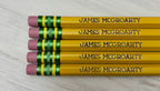 Five personalized yellow pencils that are engraved.